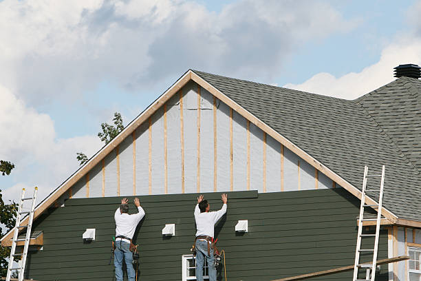 Professional Storm Damage Siding Repair technician working in Loudonville, NY